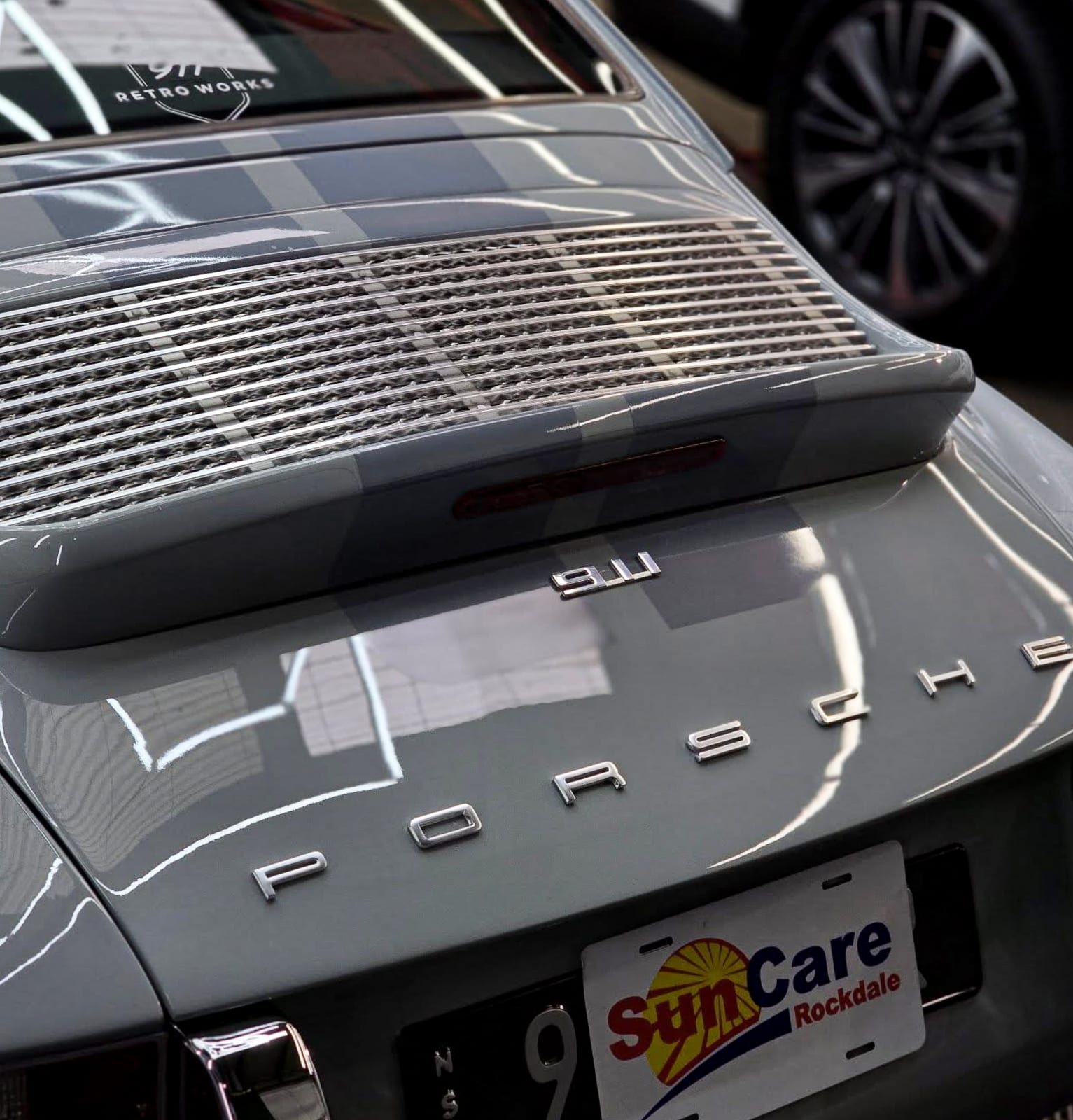 Porsche badge detail after ceramic coating
